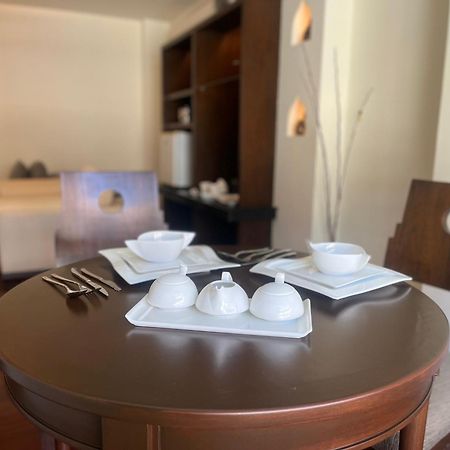 芭东帕拉贡水疗度假村【SHA Plus+】 Patong 外观 照片 A table set for breakfast at a hotel